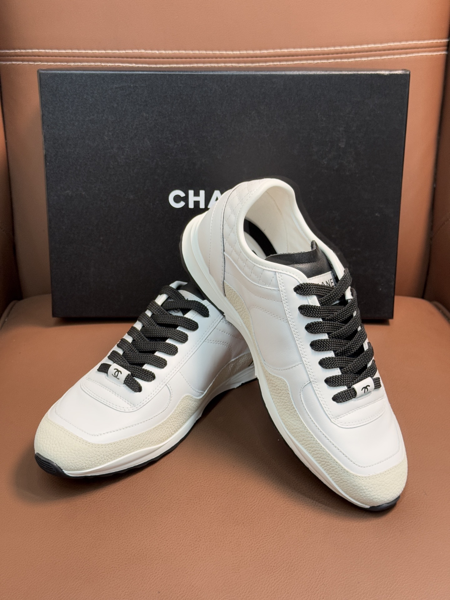 Chanel Luxury White Leather Sneakers with Black CC Logo Detail