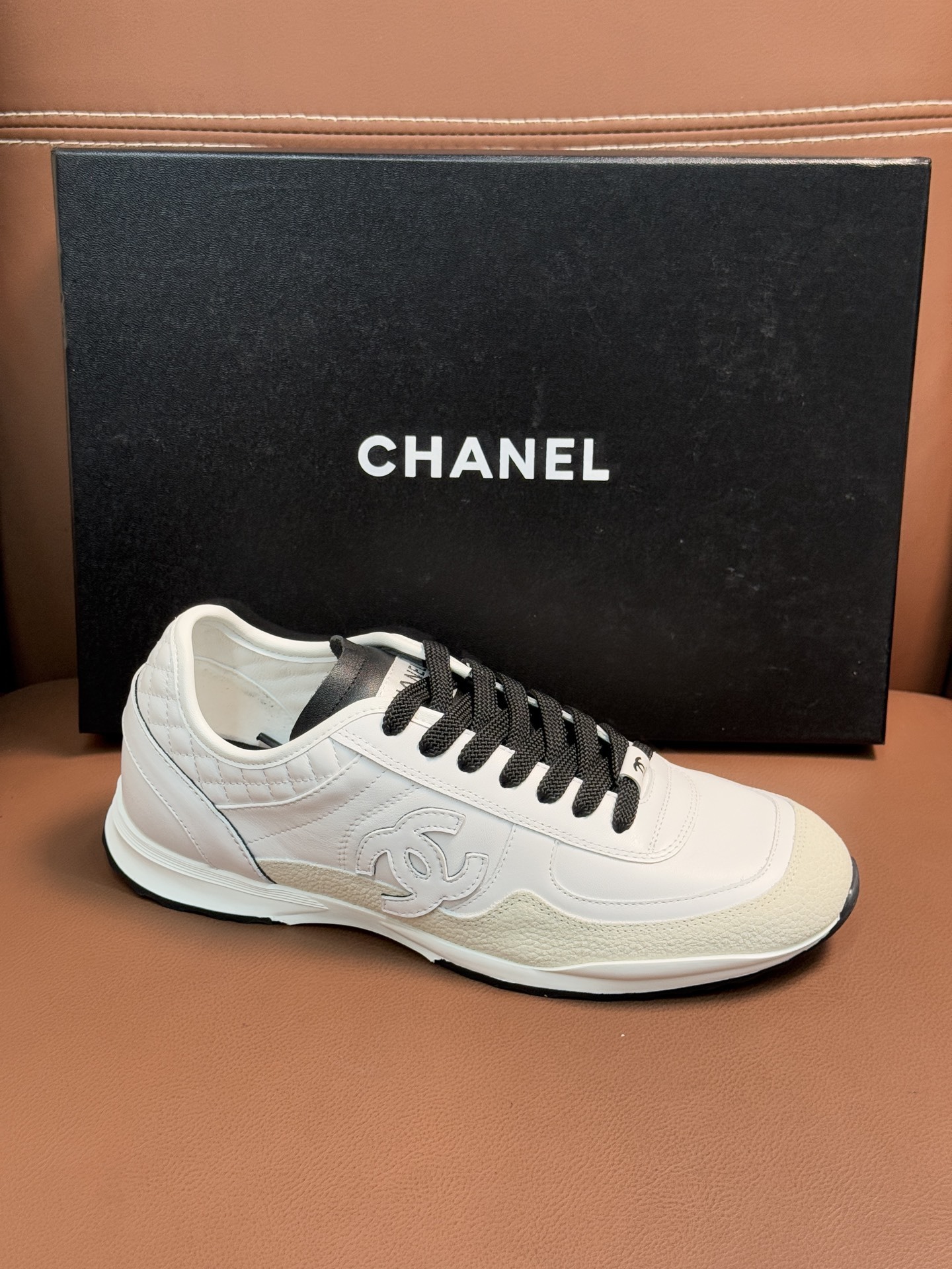 Chanel Luxury White Leather Sneakers with Black CC Logo Detail