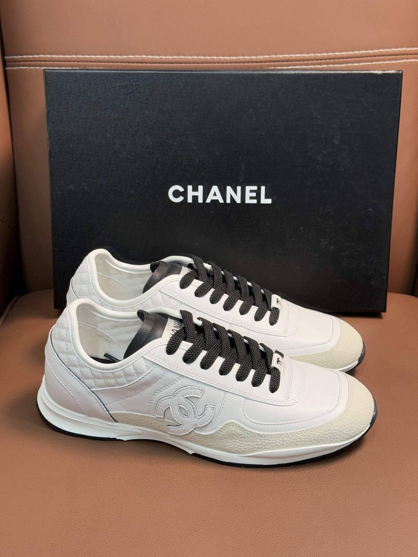 Chanel Luxury White Leather Sneakers with Black CC Logo Detail
