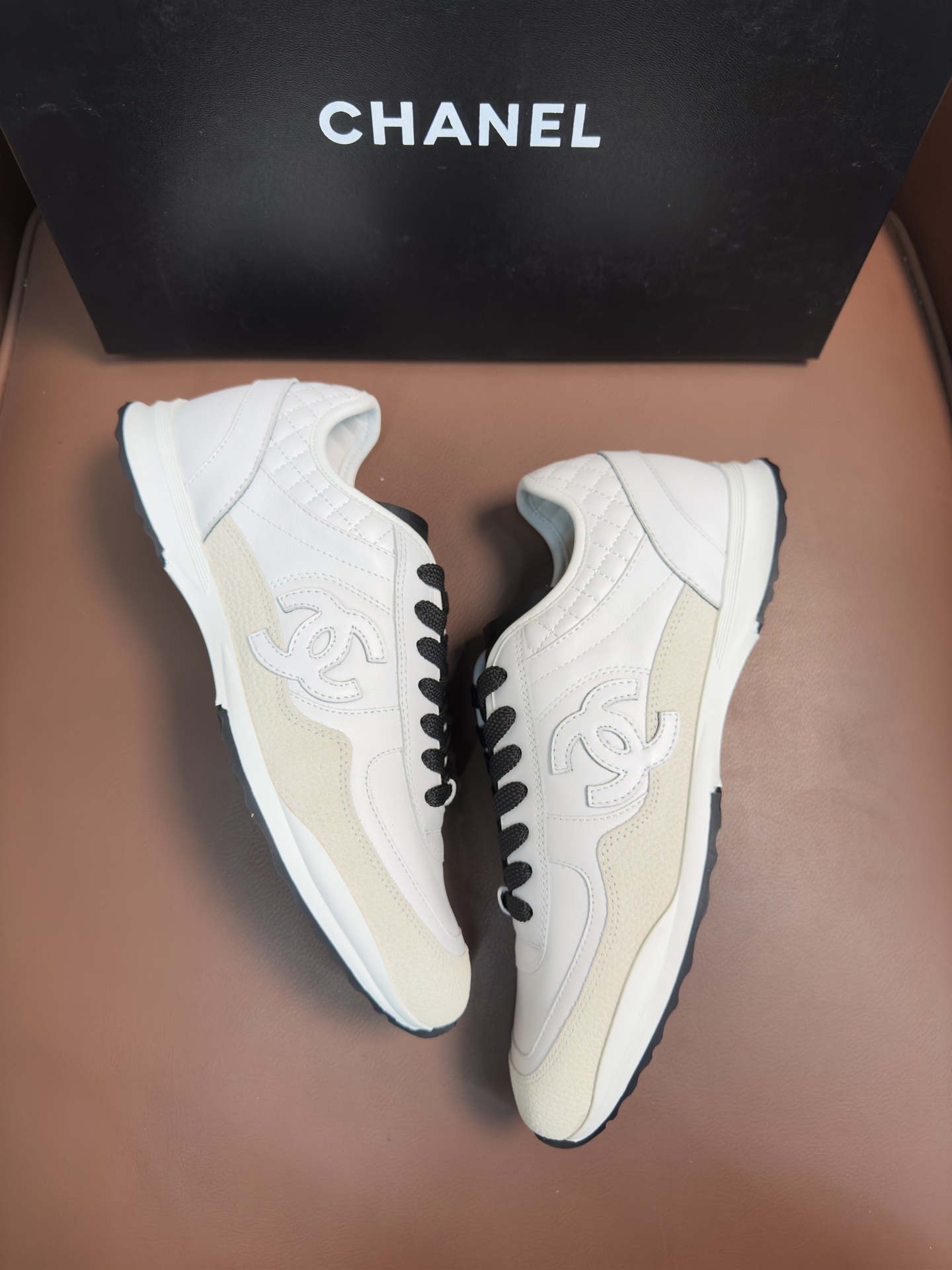 Chanel Luxury White Leather Sneakers with Black CC Logo Detail