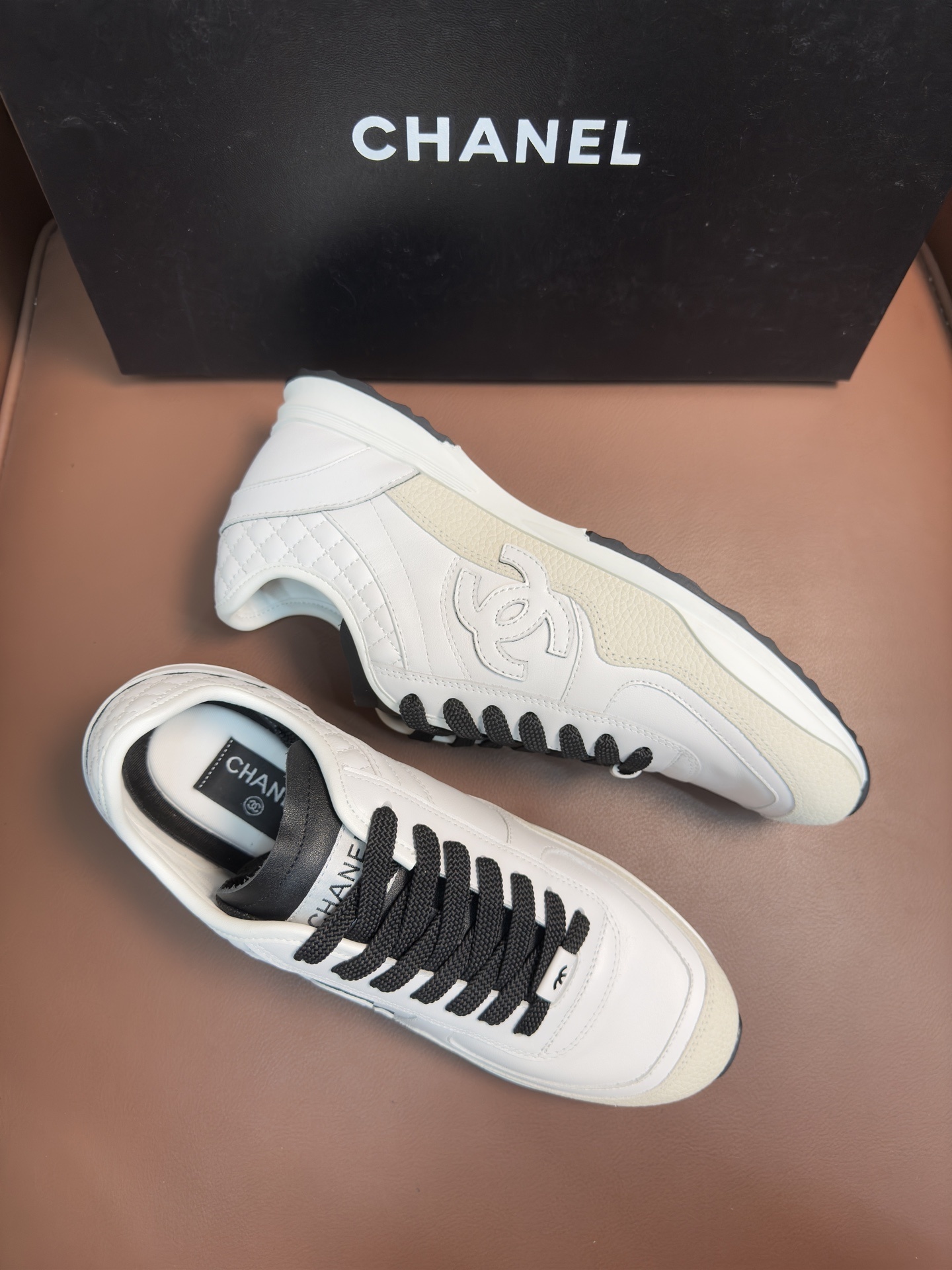 Chanel Luxury White Leather Sneakers with Black CC Logo Detail
