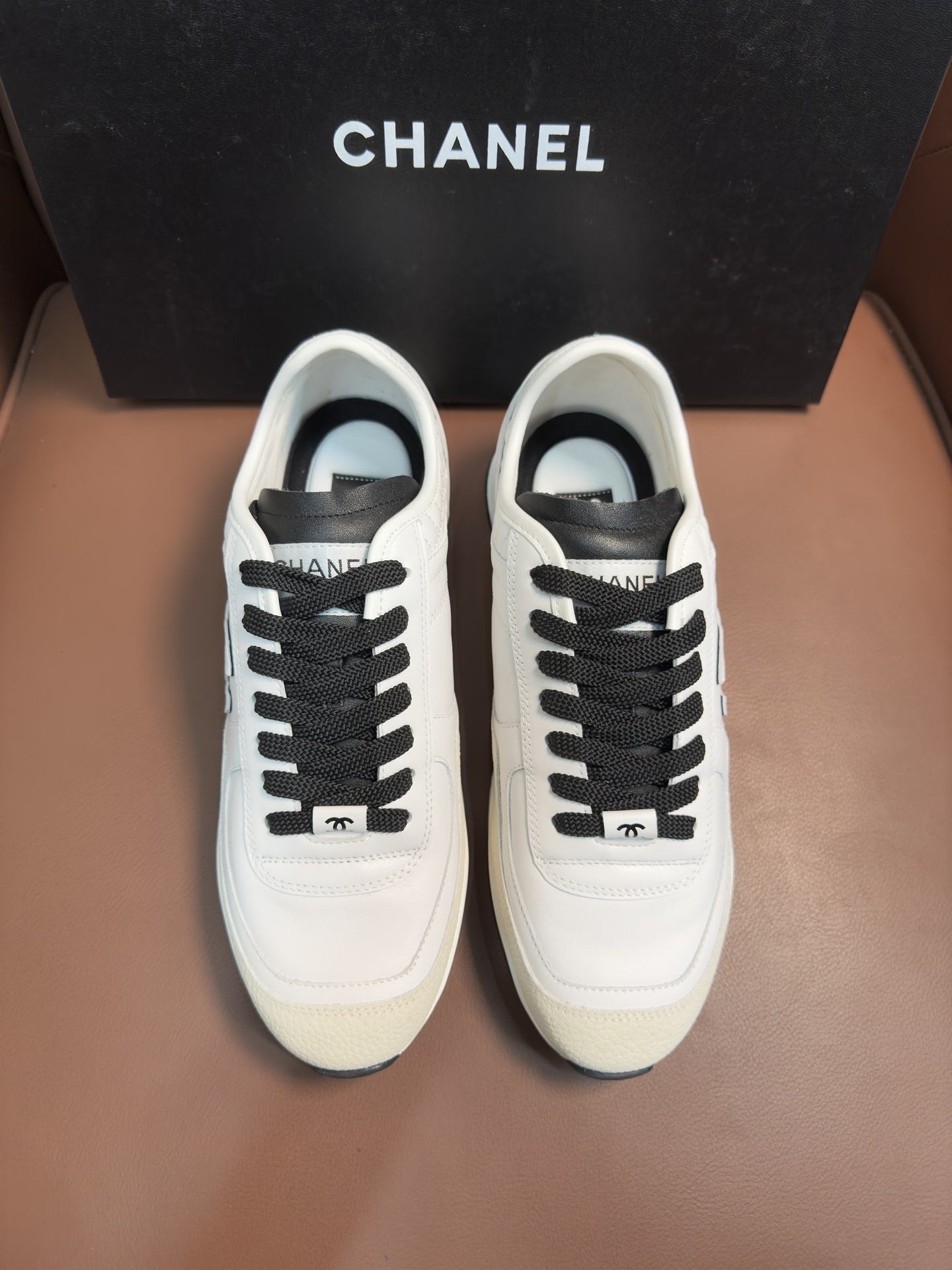 Chanel Luxury White Leather Sneakers with Black CC Logo Detail