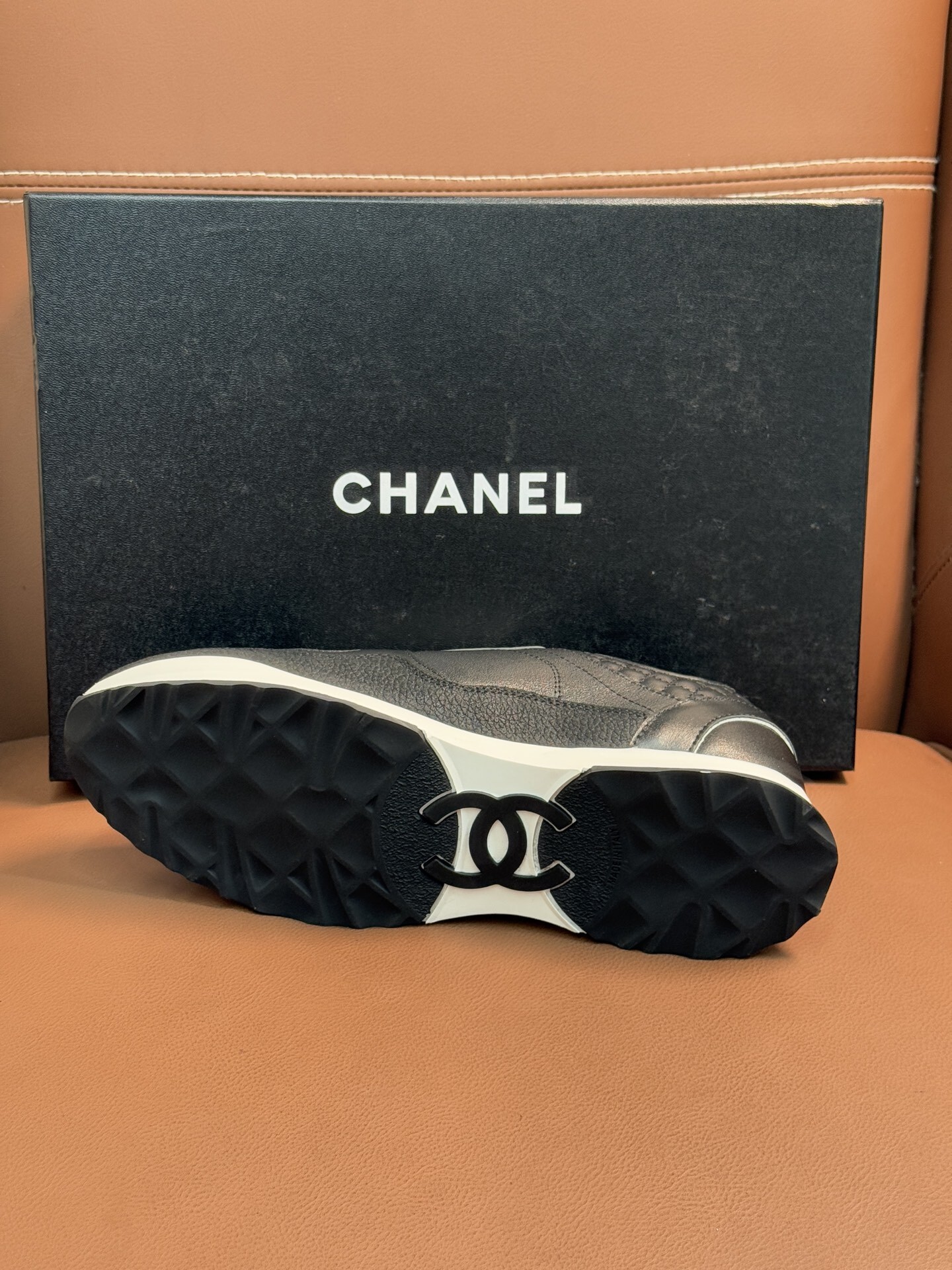 Chanel Black & White Leather Sneakers - Classic CC Logo Design