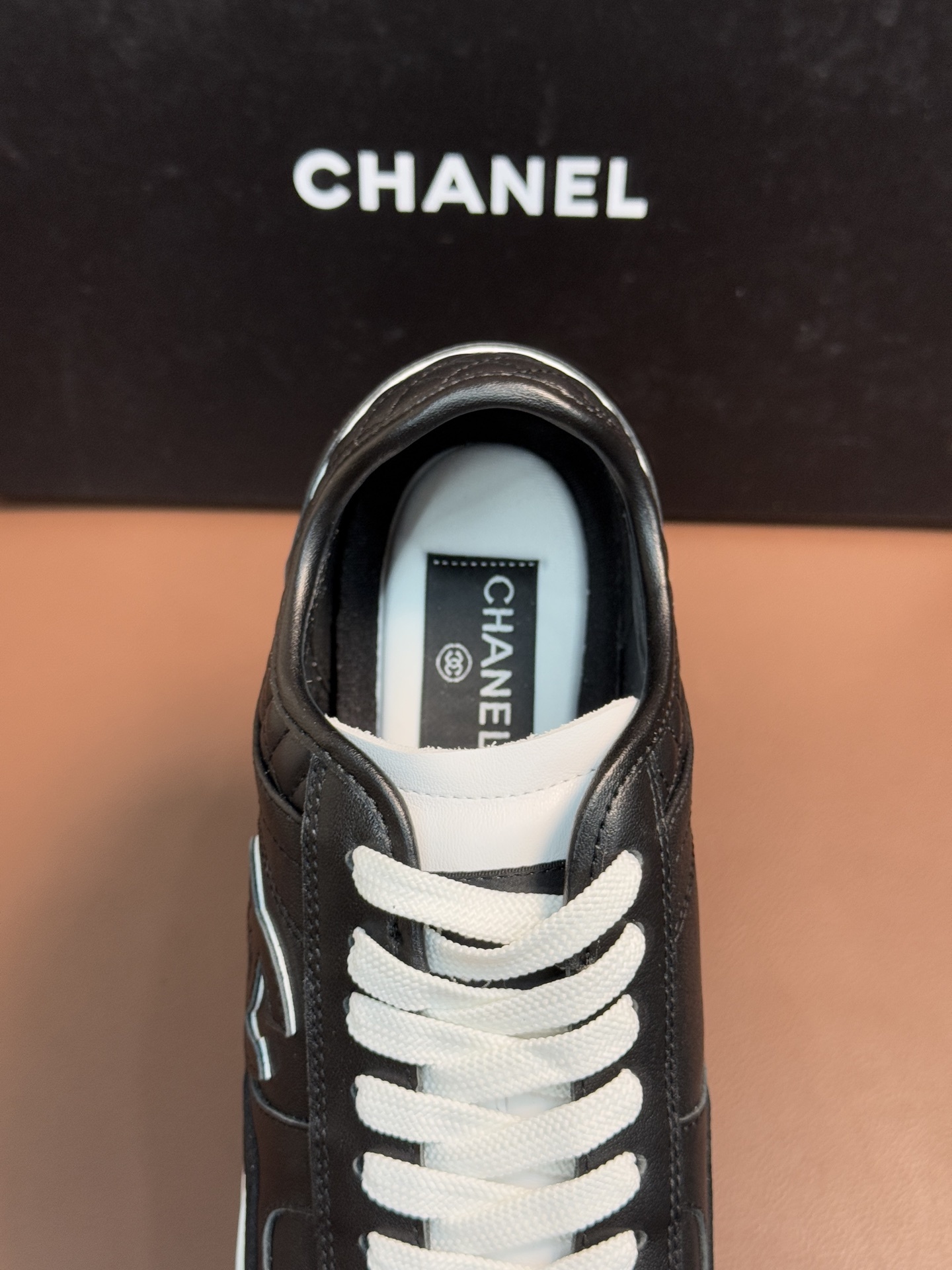 Chanel Black & White Leather Sneakers - Classic CC Logo Design