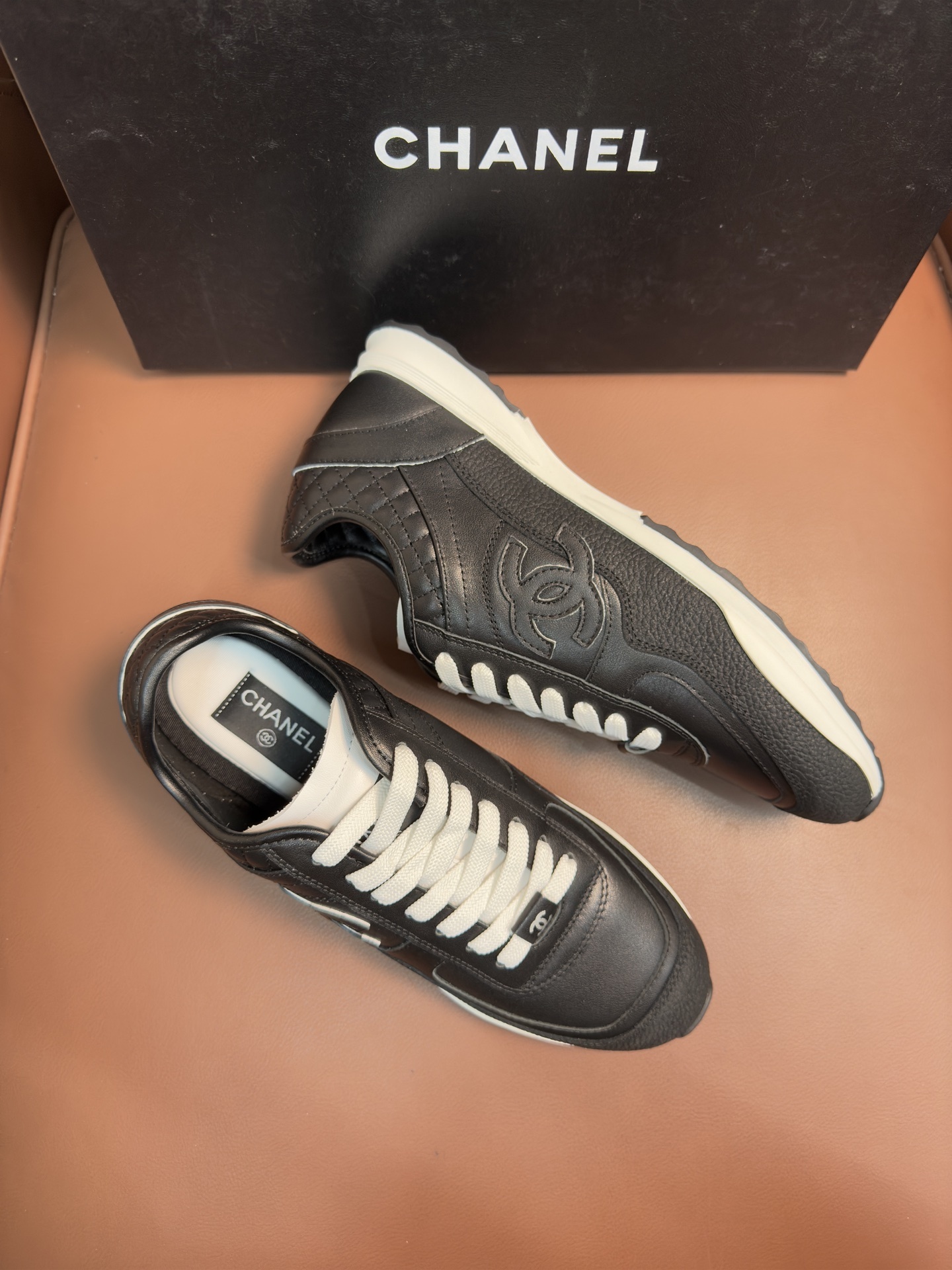 Chanel Black & White Leather Sneakers - Classic CC Logo Design