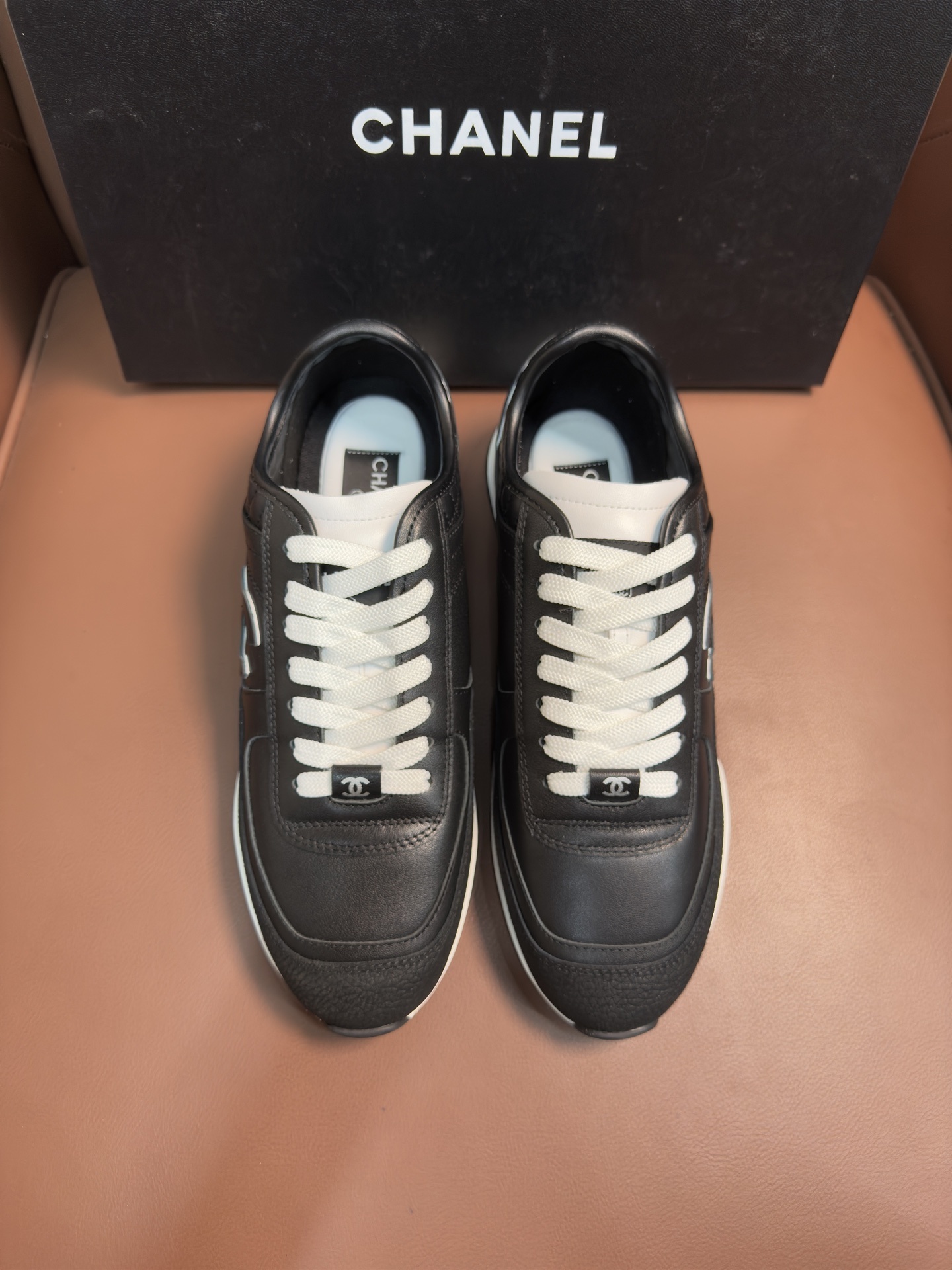 Chanel Black & White Leather Sneakers – Classic CC Logo Design