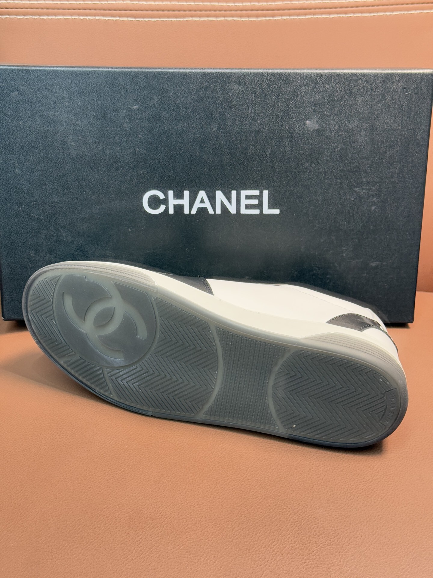 Chanel Luxury Black and White Leather Sneakers with CC Logo