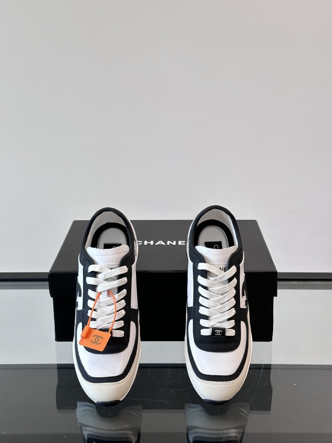 Luxury Chanel CC Logo Sneakers - Black & White Leather Trainers