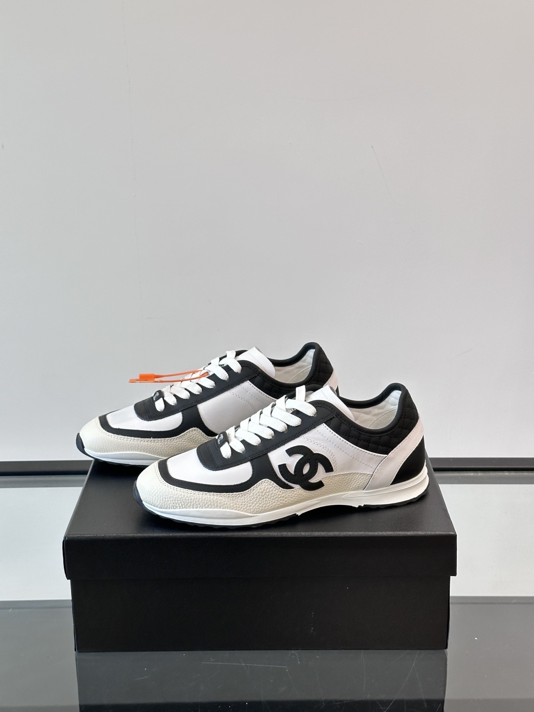 Luxury Chanel CC Logo Sneakers - Black & White Leather Trainers