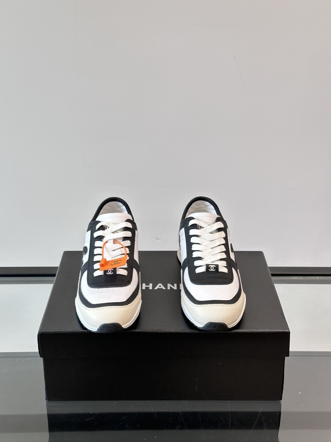 Luxury Chanel CC Logo Sneakers - Black & White Leather Trainers