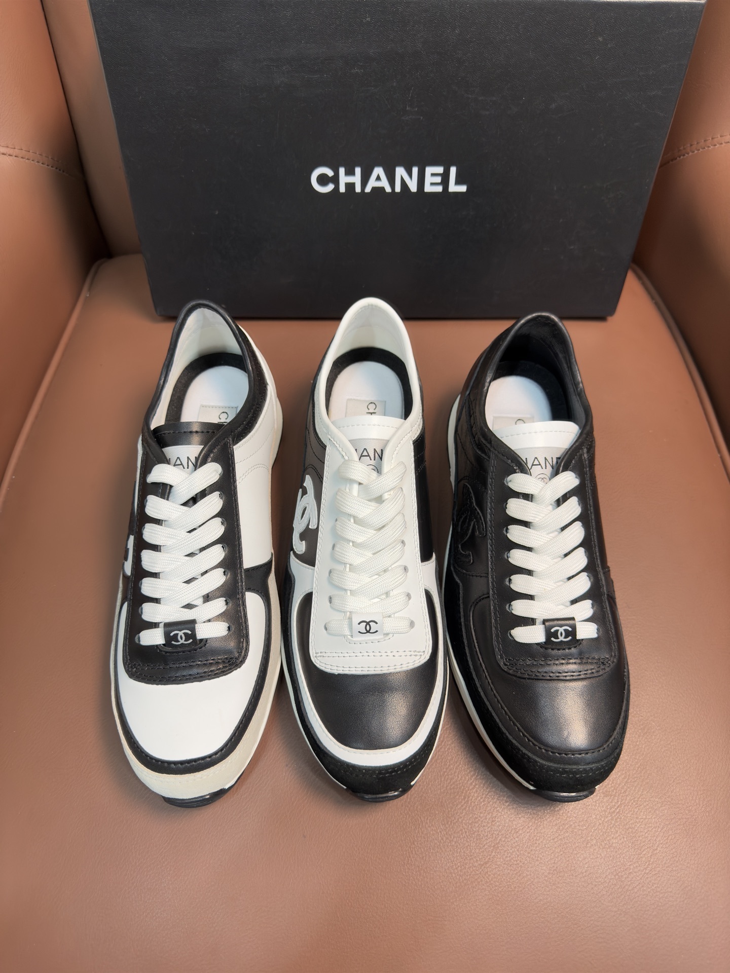 Chanel Women's Black & White Leather Sneakers - Classic CC Logo