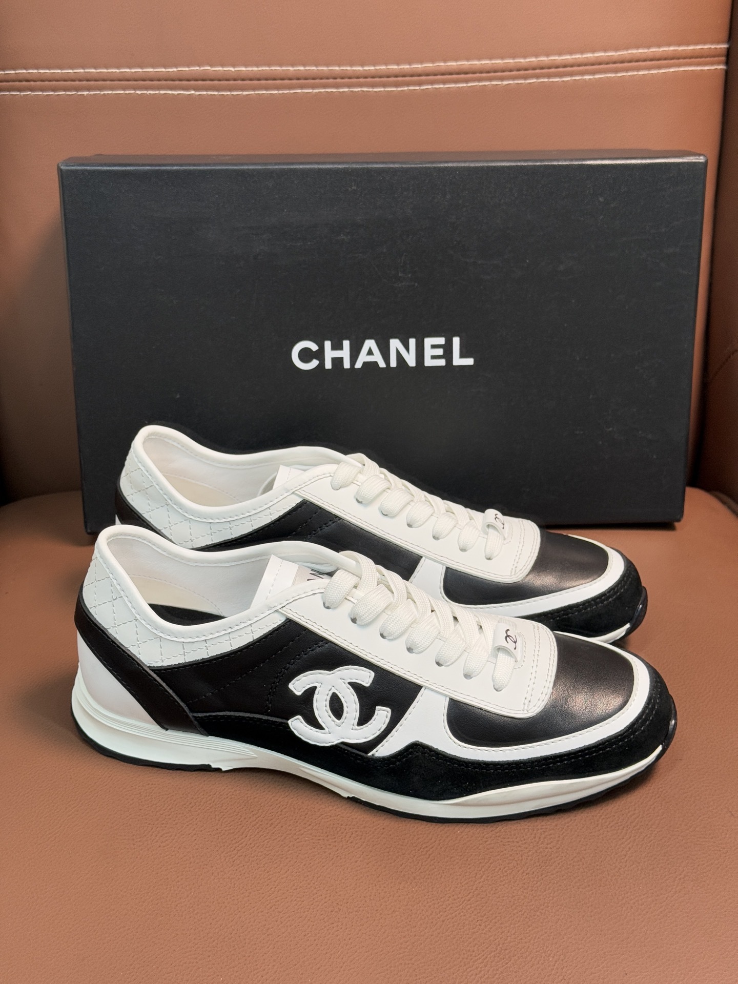 Chanel Women's Black & White Leather Sneakers - Classic CC Logo