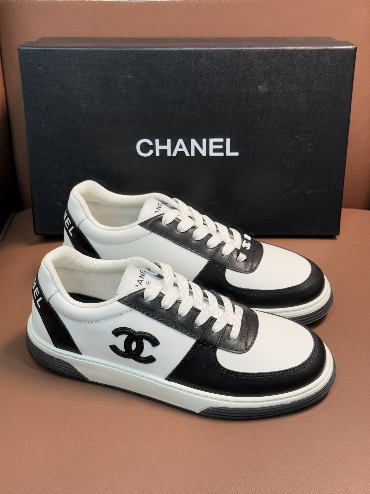 Chanel Black and White Leather Sneakers - Luxury Designer Trainers