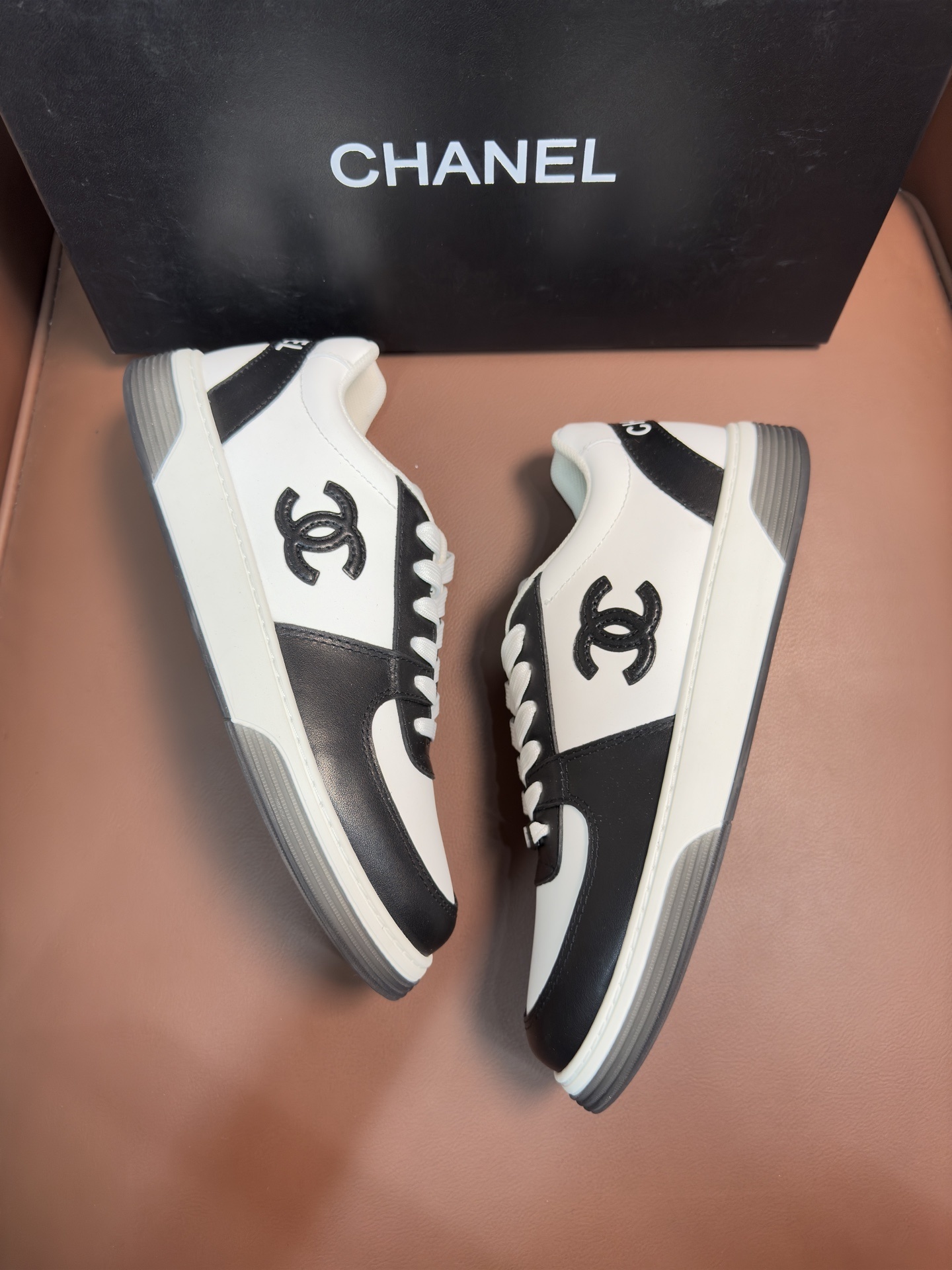 Chanel Black and White Leather Sneakers - Luxury Designer Trainers