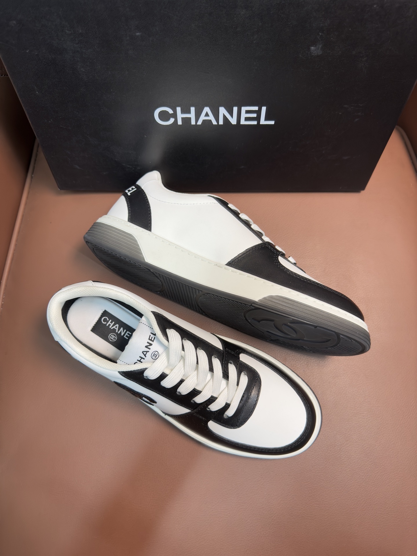 Chanel Black and White Leather Sneakers - Luxury Designer Trainers
