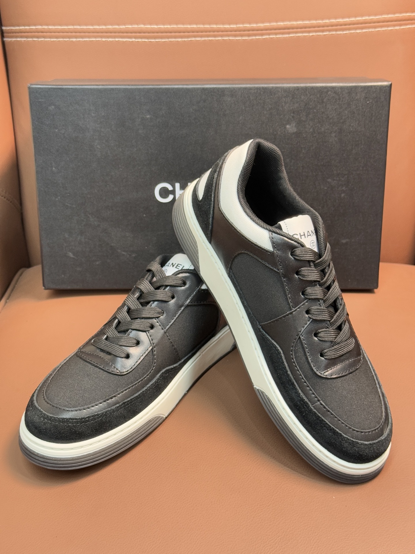 Chanel CC Logo Black & White Low-Top Sneakers - Luxury Fashion