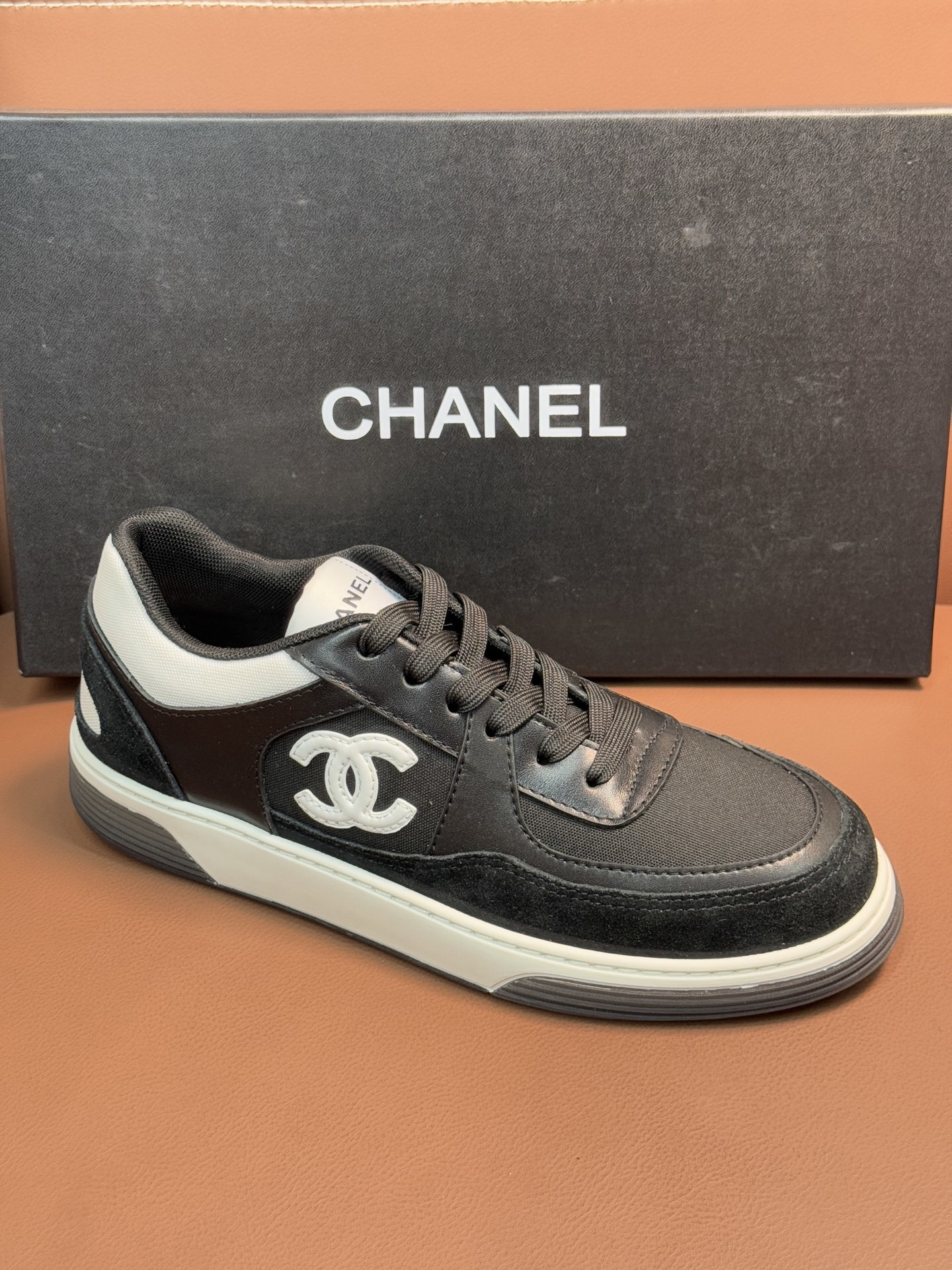 Chanel CC Logo Black & White Low-Top Sneakers - Luxury Fashion