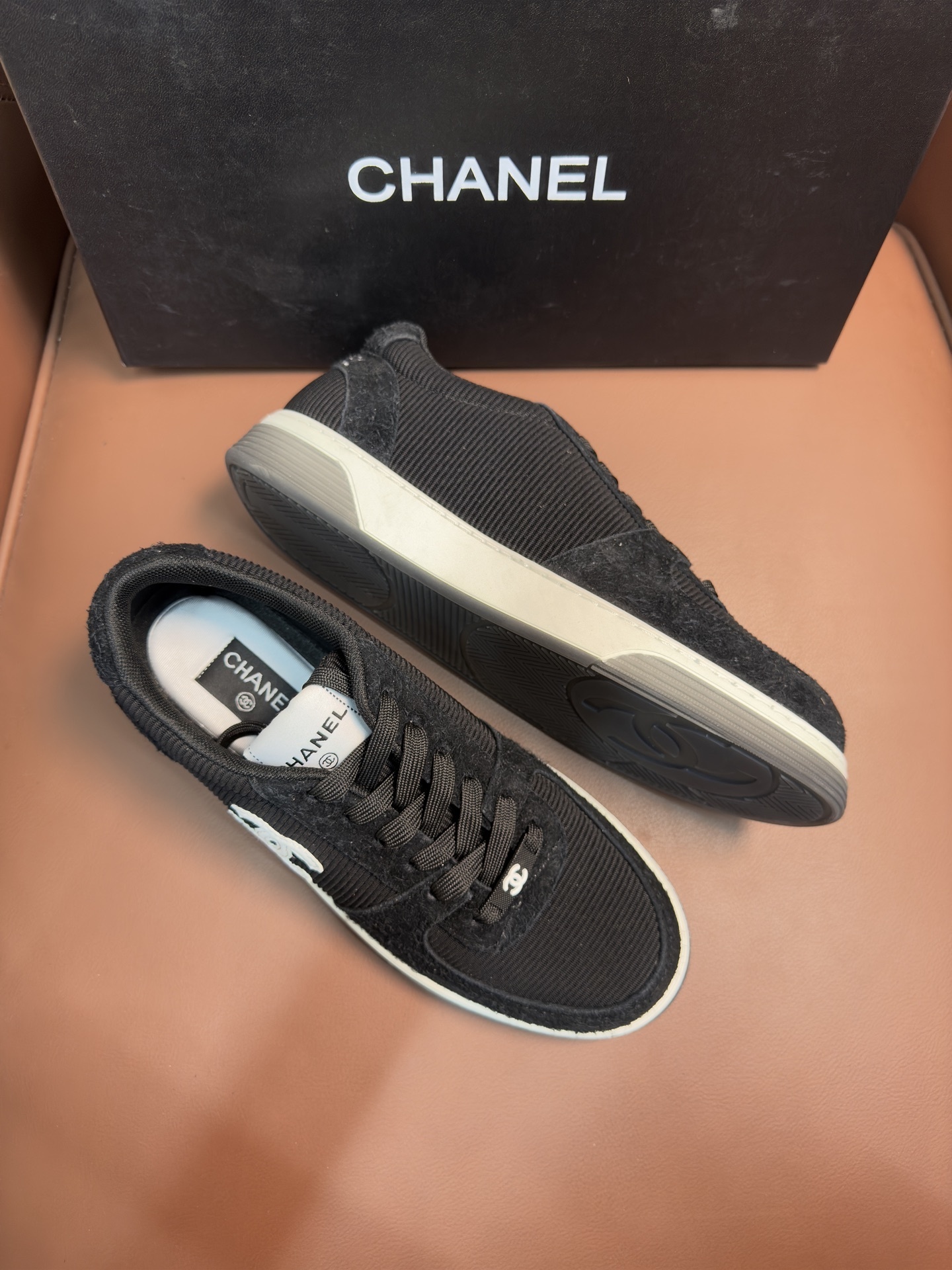 Chanel Luxury Black Ribbed Fabric Sneakers with Iconic CC Logo