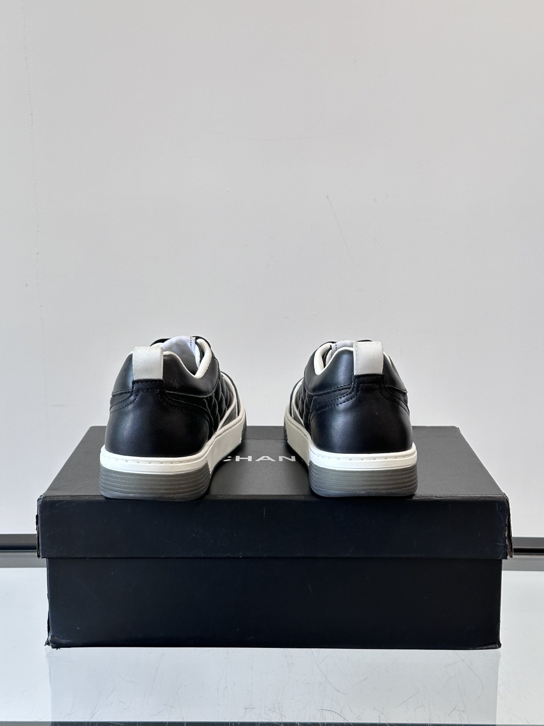 Luxury Black Quilted Leather Sneakers with White Interlocking C