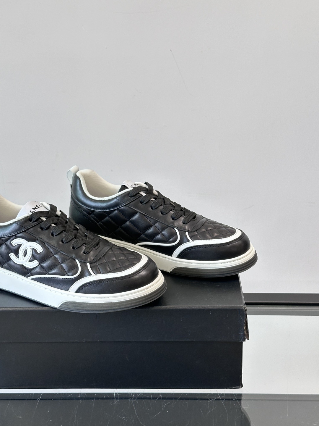 Luxury Black Quilted Leather Sneakers with White Interlocking C