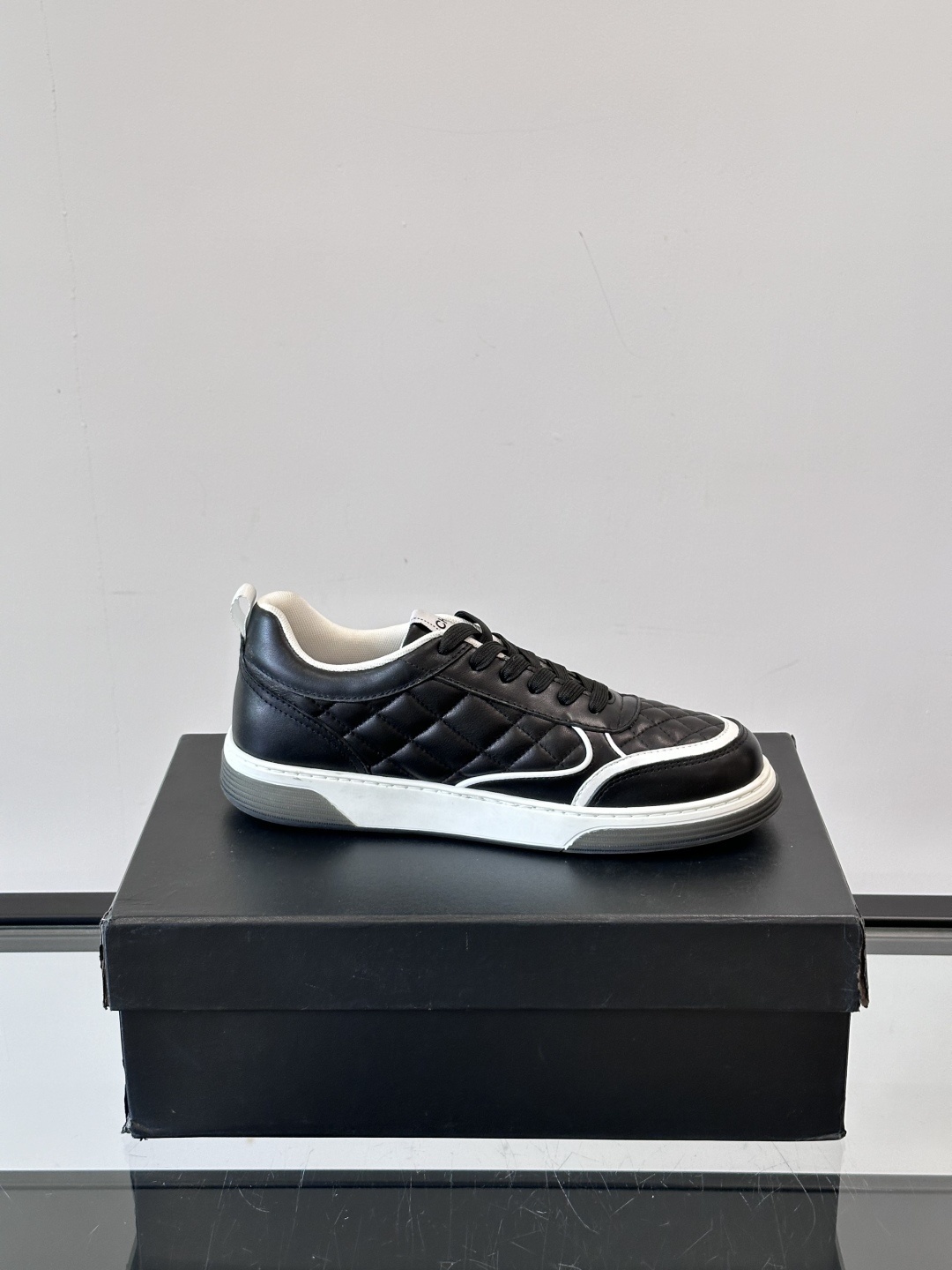 Luxury Black Quilted Leather Sneakers with White Interlocking C