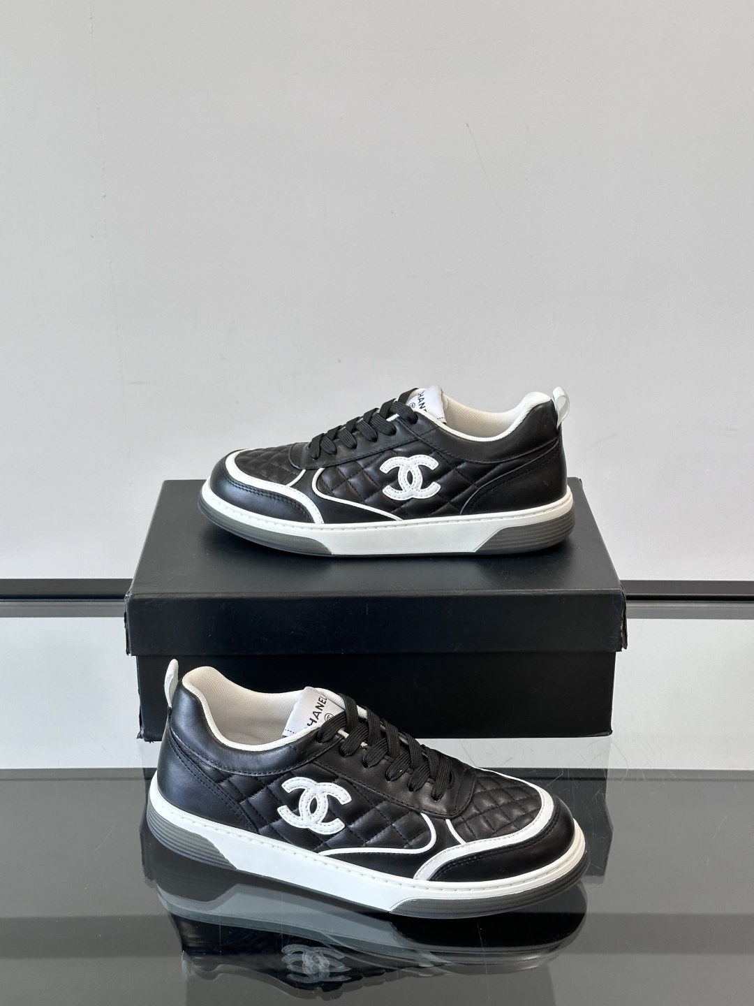 Luxury Black Quilted Leather Sneakers with White Interlocking C