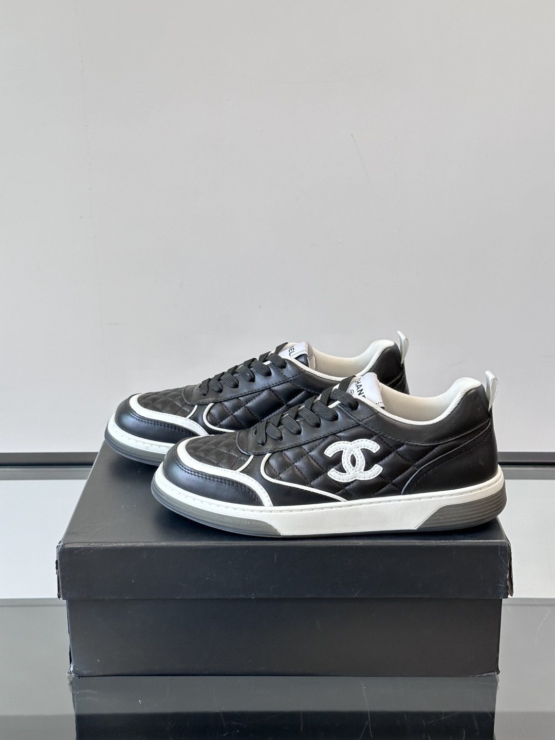 Luxury Black Quilted Leather Sneakers with White Interlocking C