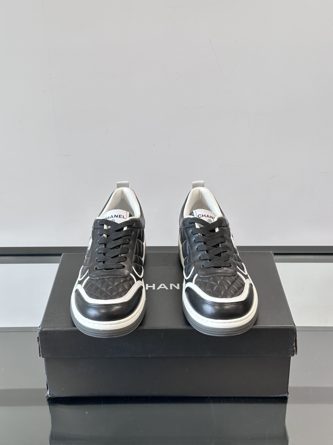 Luxury Black Quilted Leather Sneakers with White Interlocking C