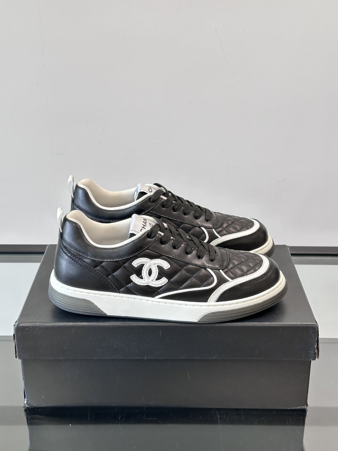 Luxury Black Quilted Leather Sneakers with White Interlocking C