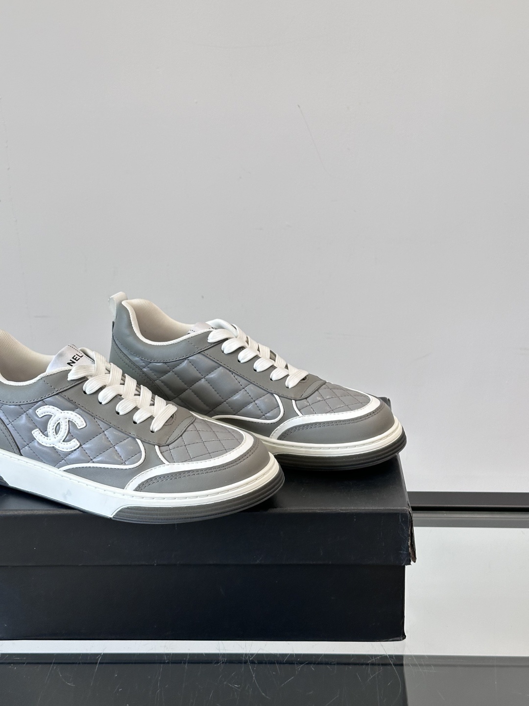 Luxury Chanel Gray Quilted Low-Top Sneakers - Women's Designer Shoes
