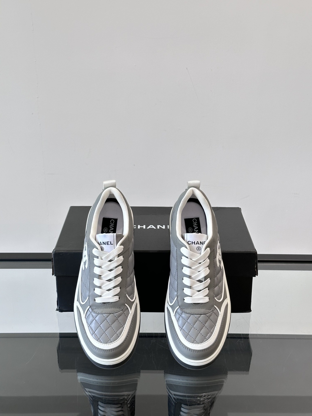 Luxury Chanel Gray Quilted Low-Top Sneakers - Women's Designer Shoes
