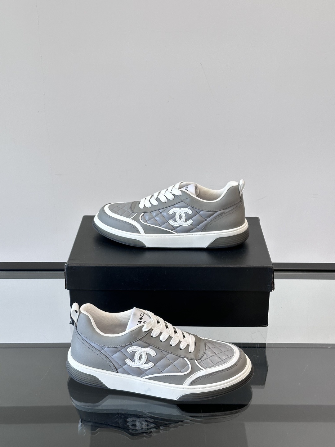 Luxury Chanel Gray Quilted Low-Top Sneakers - Women's Designer Shoes