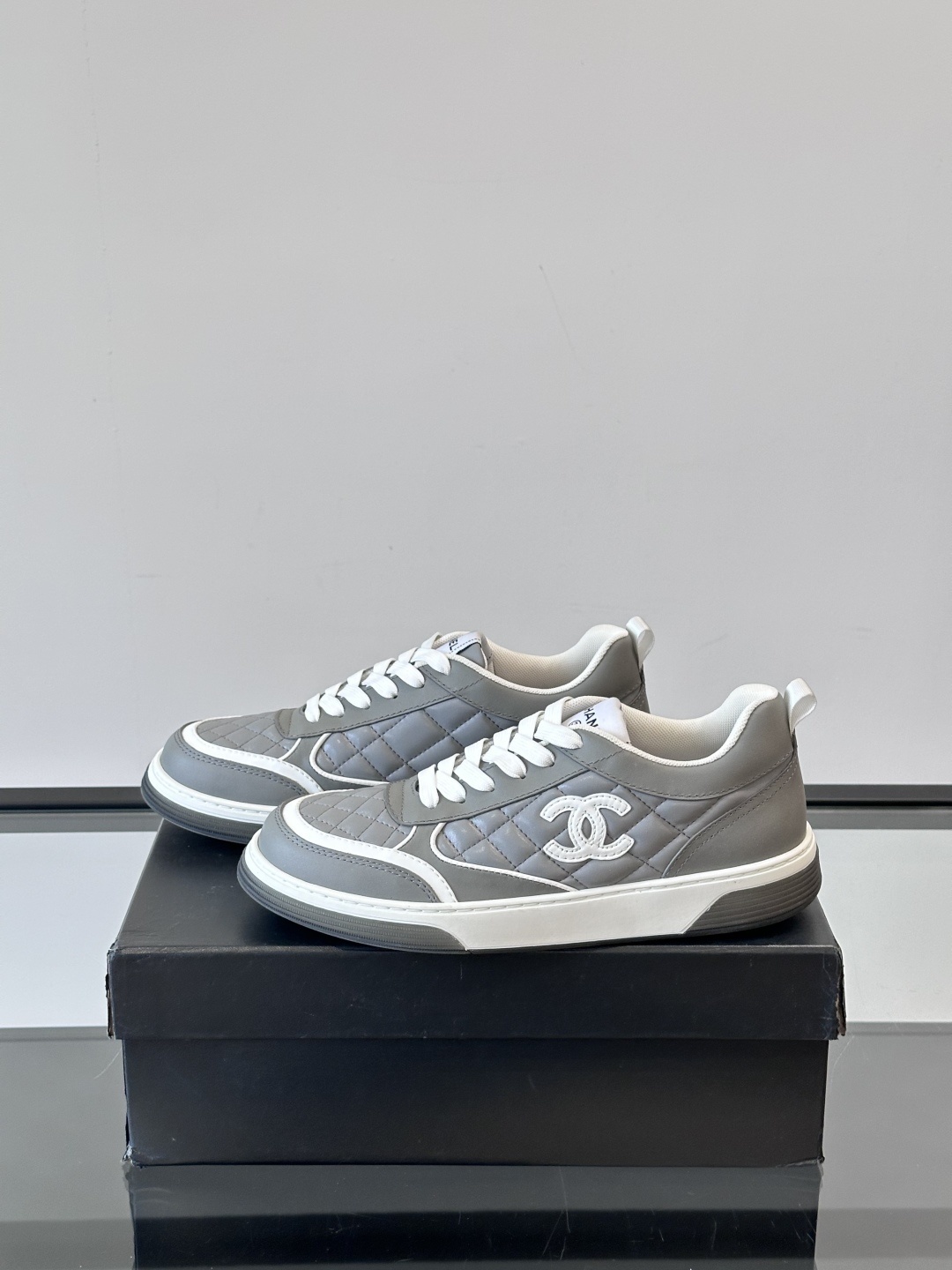 Luxury Chanel Gray Quilted Low-Top Sneakers - Women's Designer Shoes