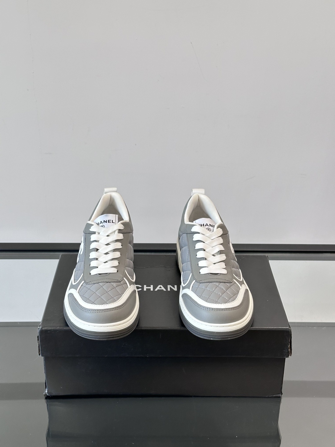 Luxury Chanel Gray Quilted Low-Top Sneakers - Women's Designer Shoes