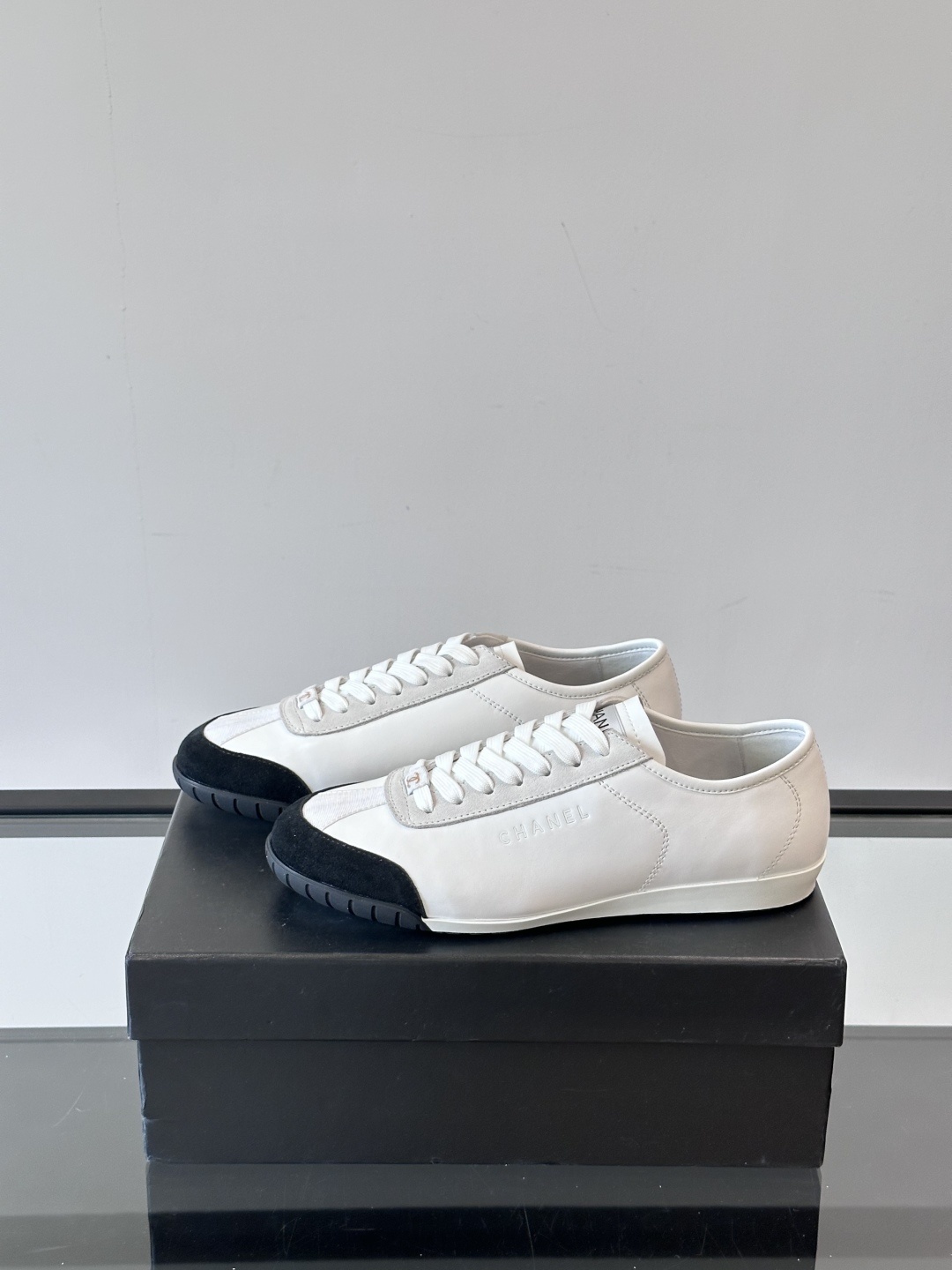 Chanel White Leather & Suede Sneakers with Black Toe Cap