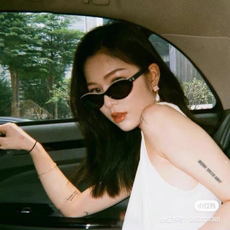 Luxury Chanel Black Oval Sunglasses - Chic Designer Eyewear