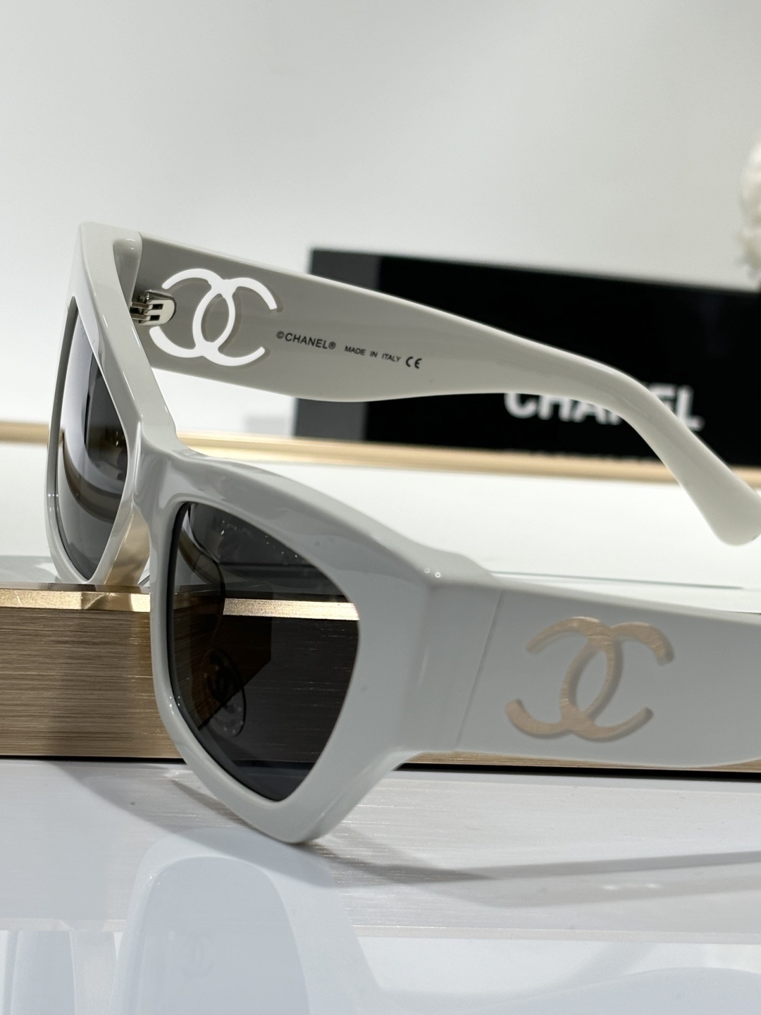 Chanel Luxury Square Sunglasses with Iconic White Cut-out Logo