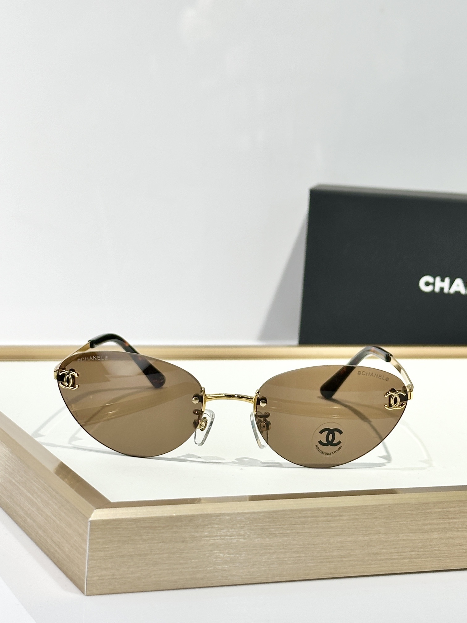 Chanel Rimless Cat-Eye Sunglasses - Gold CC Logo & Tinted Lenses
