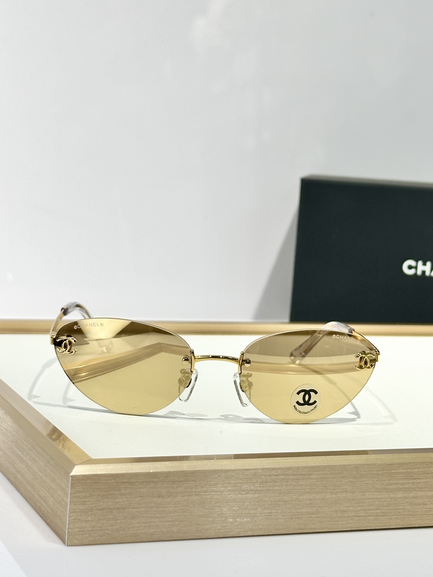 Chanel Rimless Cat-Eye Sunglasses – Gold CC Logo & Tinted Lenses