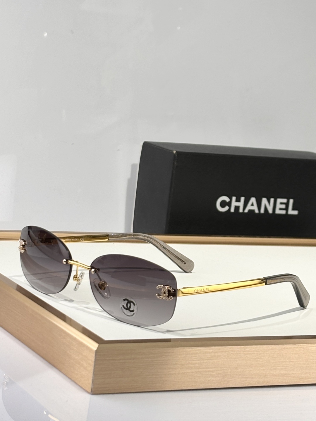 Chanel Luxury Rimless Oval Sunglasses with Rhinestone CC Logo