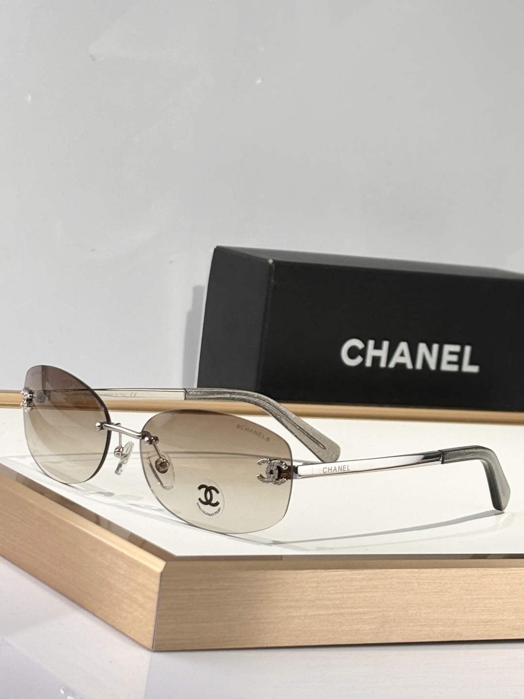 Chanel Luxury Rimless Oval Sunglasses with Rhinestone CC Logo