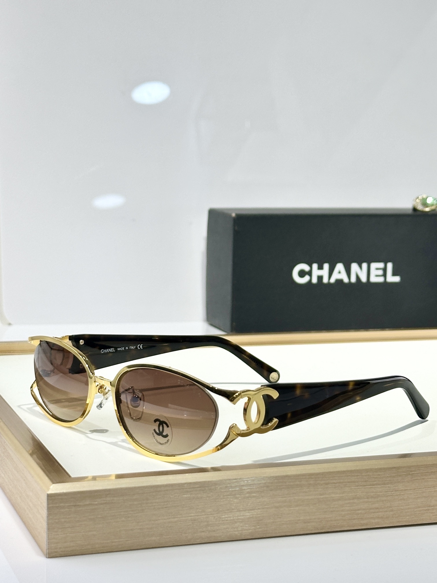 Chanel Luxury Oval Sunglasses with Signature Gold CC Logo