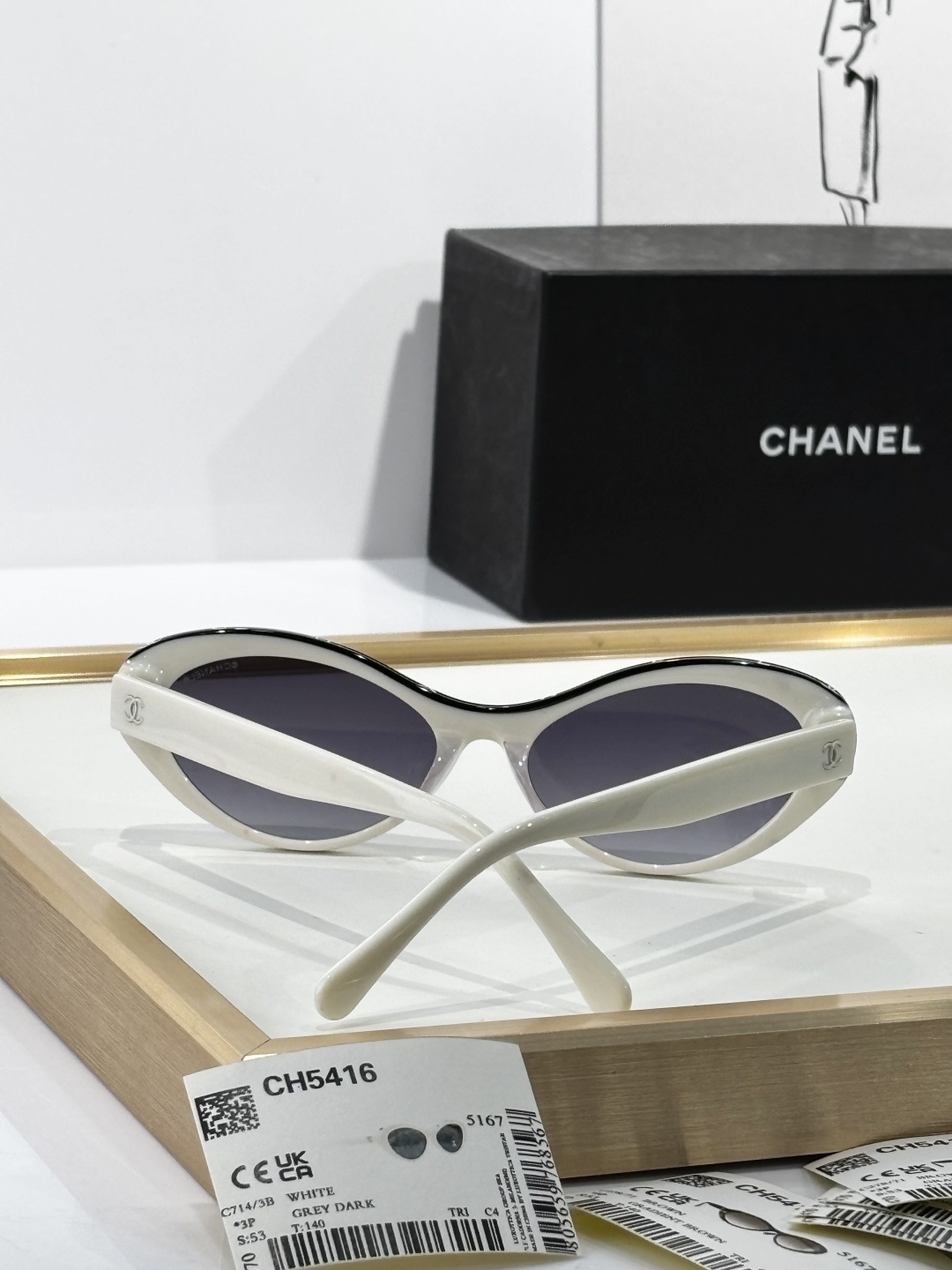 Chanel Luxury Oval Sunglasses - White Acetate with Black Logo Rim
