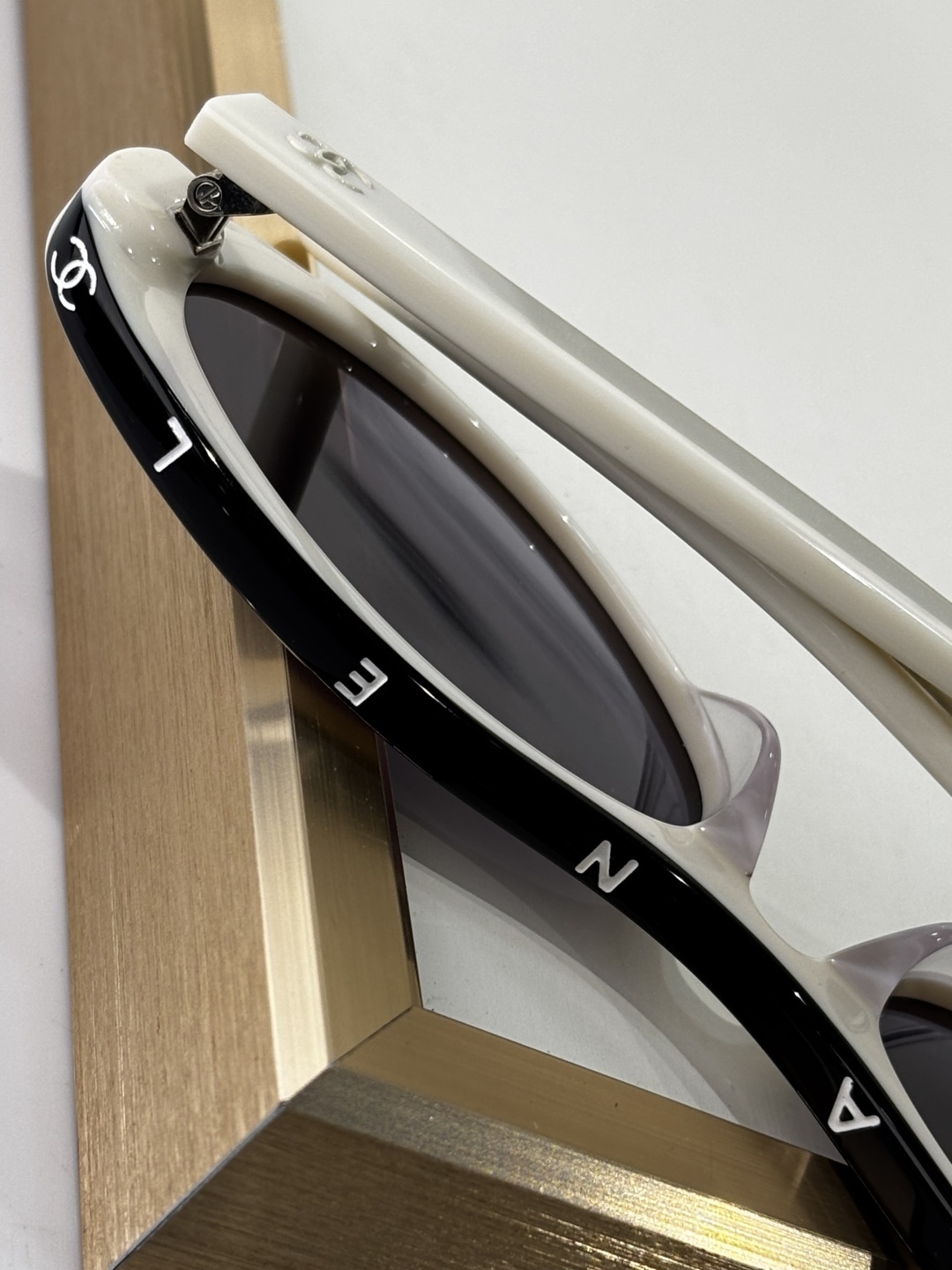 Chanel Luxury Oval Sunglasses - White Acetate with Black Logo Rim