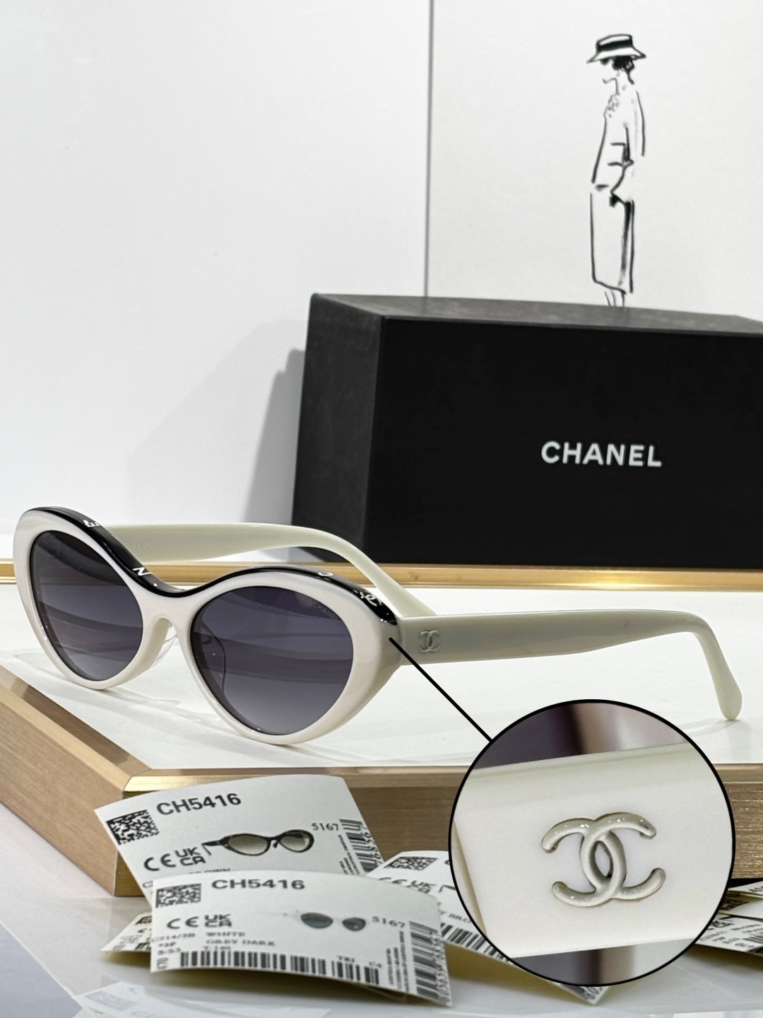 Chanel Luxury Oval Sunglasses - White Acetate with Black Logo Rim