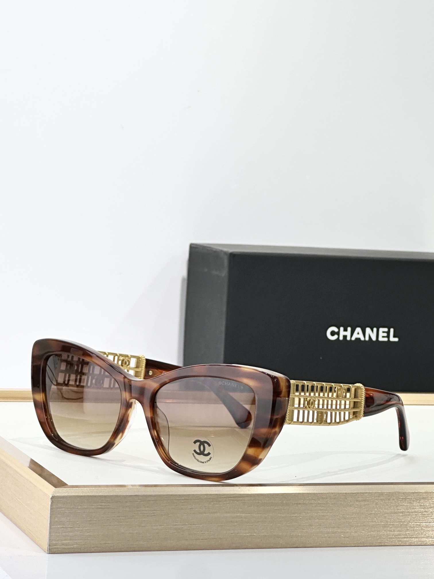 Chanel Luxury Cat-Eye Sunglasses with Gold Cage CC Logo Temples