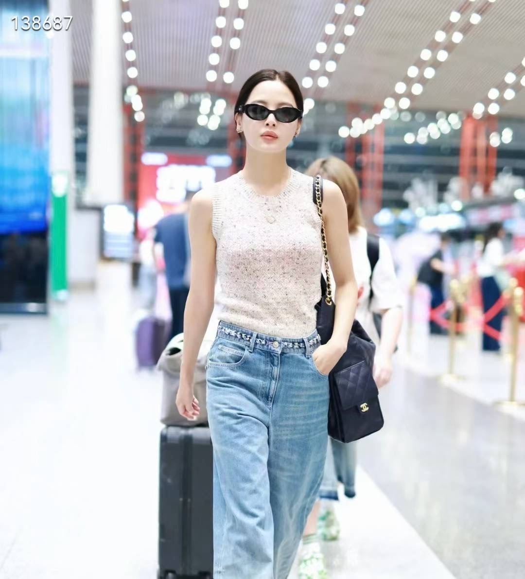 Chanel Black Oval Sunglasses with Leather Bow Detail - Luxury Eyewear