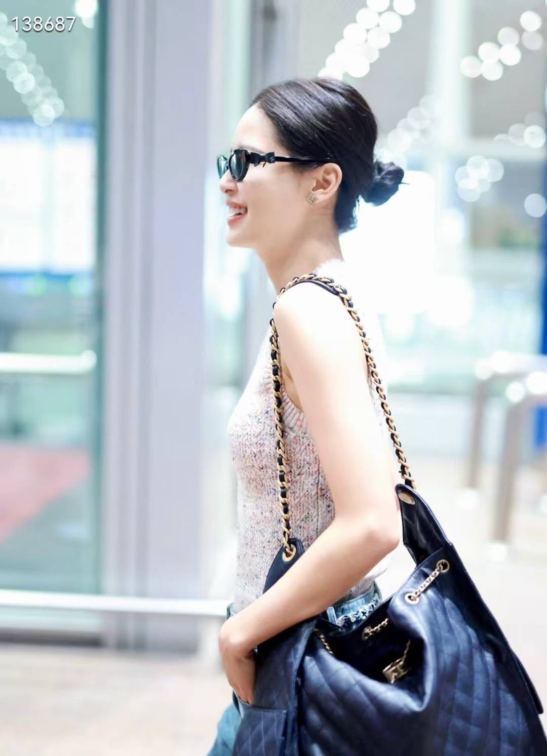 Chanel Black Oval Sunglasses with Leather Bow Detail - Luxury Eyewear