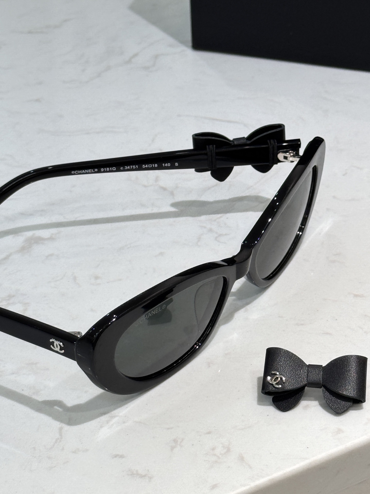 Chanel Black Oval Bow Sunglasses - Luxury Women's Eyewear