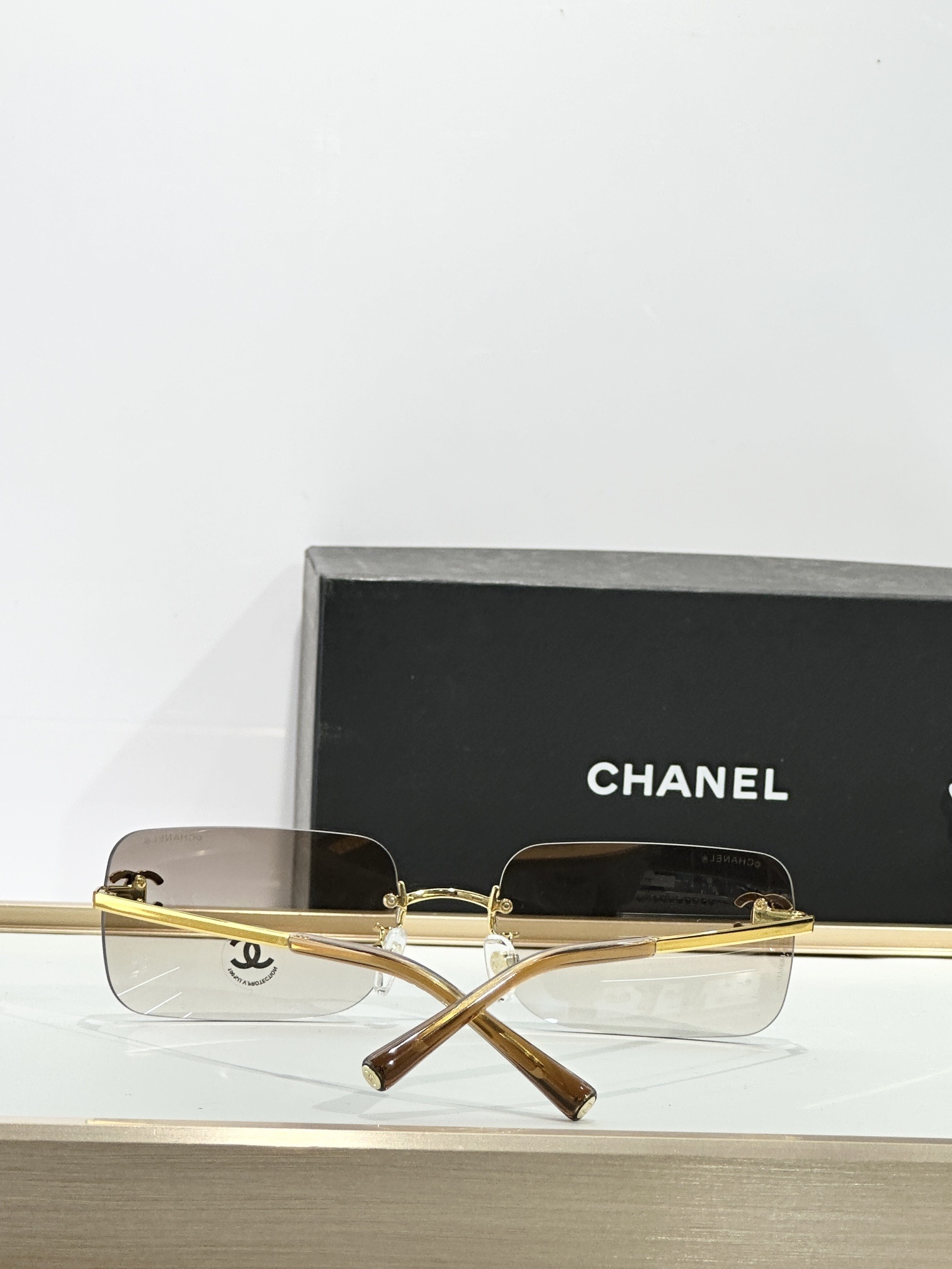 Chanel Luxury Rimless Sunglasses with Rhinestone CC Logo